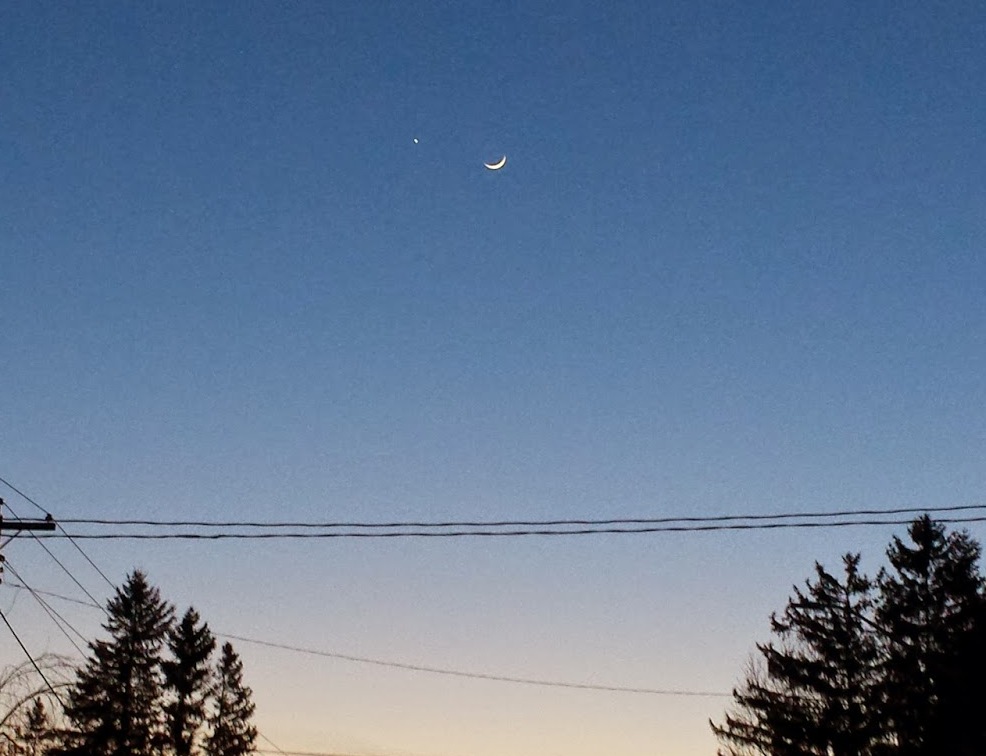 Shortly after sunset on the evening of Feb. 2, 2015, the author took this wide-field image of the young crescent moon with earthshine and the bright planet Venus using a Samsung Galaxy S5 smartphone.