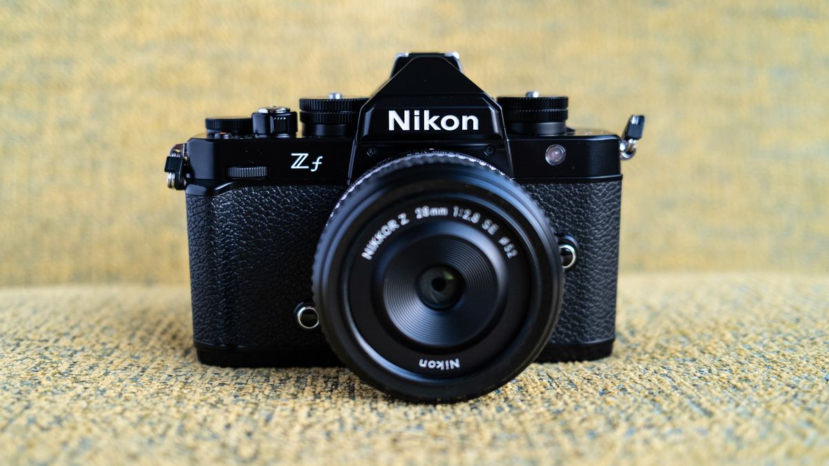 Nikon Z f camera on a vintage-style yellow chair