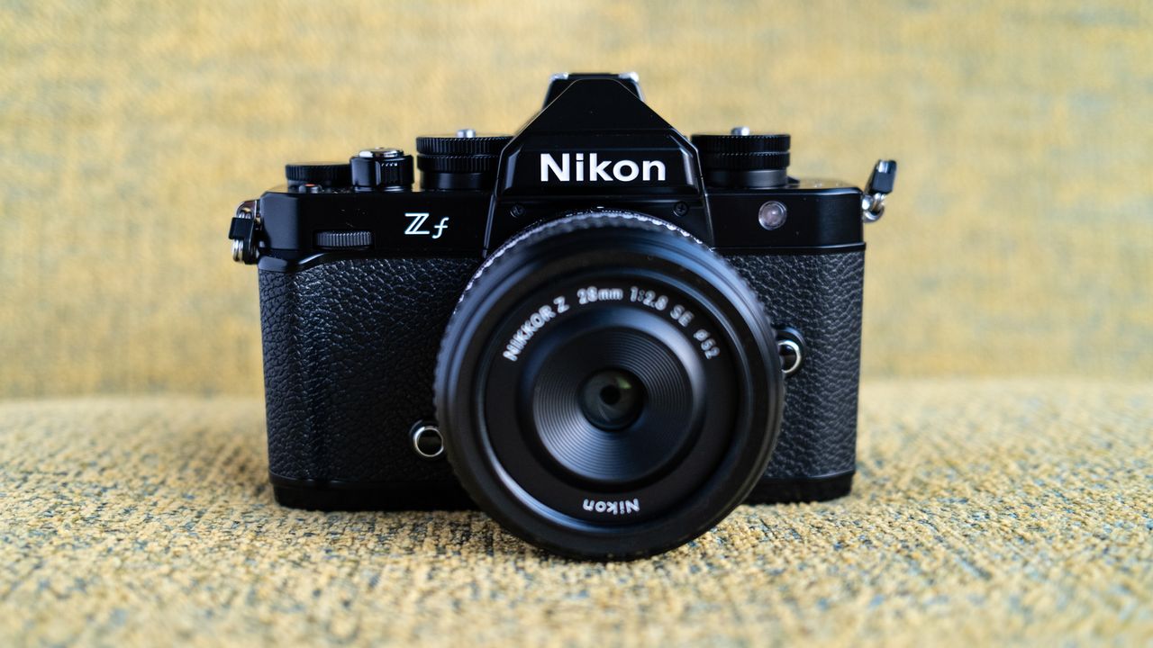 Nikon Z f camera on a vintage-style yellow chair