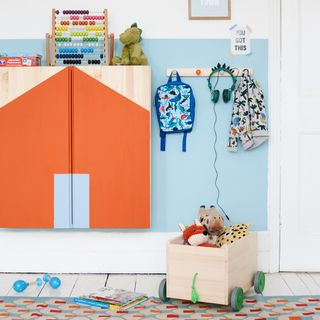 children's bedroom with toys and painted cupboard
