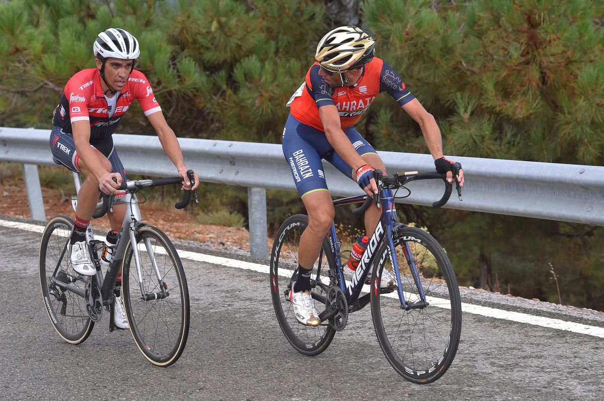 Vincenzo Nibali (Bahrain-Merida) checks on Alberto Contador during the climb