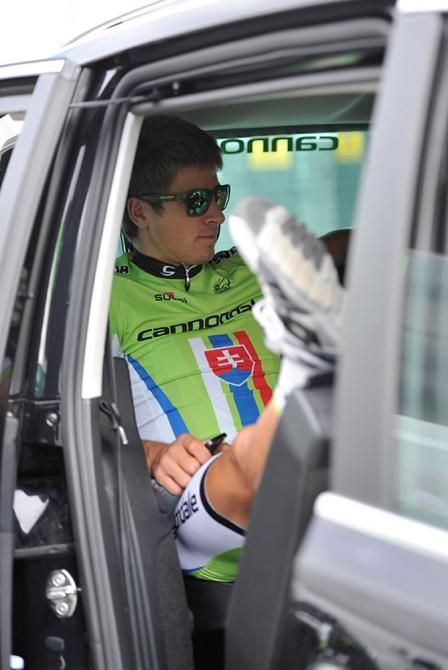Peter Sagan team Cannondale sits in the back of his team car with his team mates.