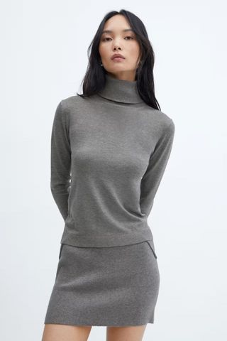 grey jumpers woman wearing fine knit turtleneck