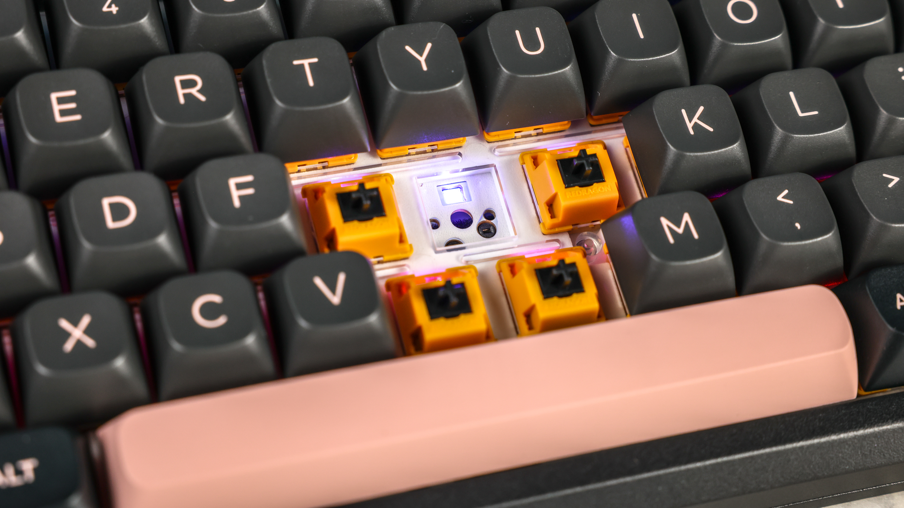 Redragon Eclipse K720 Pro photographed in front of a blue background.