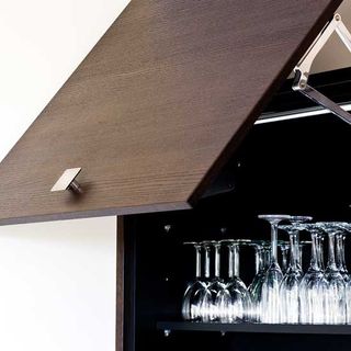 sturdy wall cabinet with with wine glasses