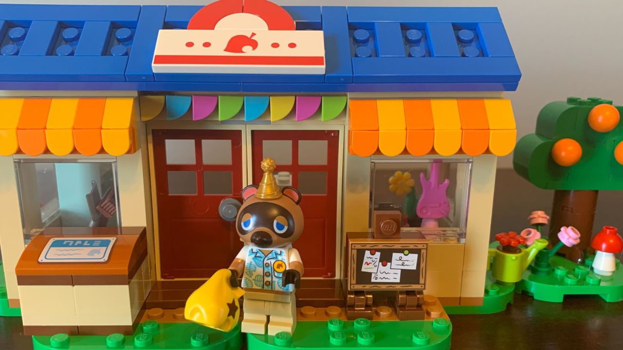 Lego Nook's Cranny &amp; Rosie's House set on a wooden surface