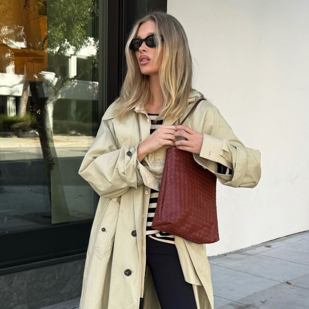 Elsa Hosk wearing a trench coat, striped shirt, cropped flare pants, and kitten-heel slingback shoes