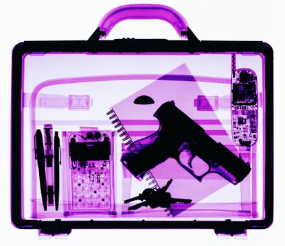 X-ray image of case containing hand gun