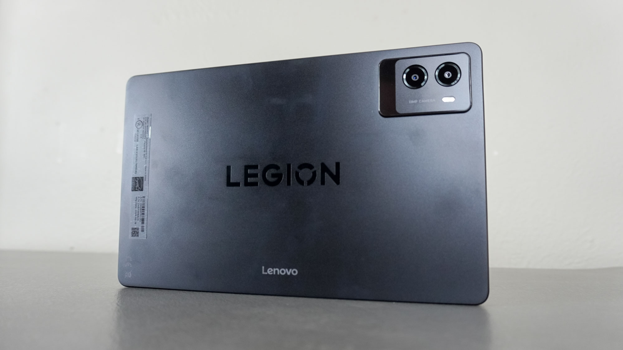 The Lenovo Legion Tab Gen 3 seen from the back on a table