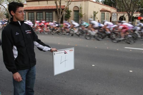 UnitedHealthcare director Mike Tamayo lets his riders know how many laps remain.