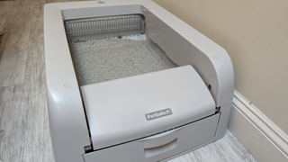 PetSafe ScoopFree Clumping Self-Cleaning Litter Box on Alisa's floor