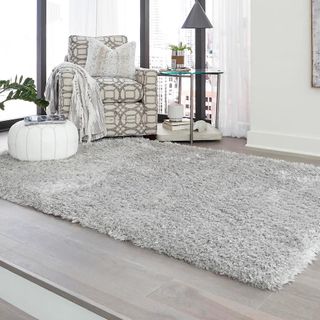 A grey high pile rug