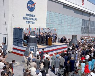 Astronaut John Glenn, Jr. is honored by President John F. Kennedy after his historical first manned orbital flight. The ceremony is being held at the Manned Spacecraft Center in Langley, Virginia. The Center moved to Houston, Texas later that year, where