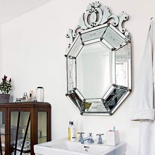 bathroom with venetian mirror and towel