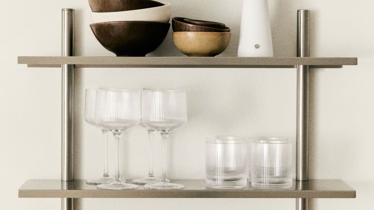 H&amp;M Home ribbed glassware on silver shelving unit with bowls and portable lamp on the top shelf