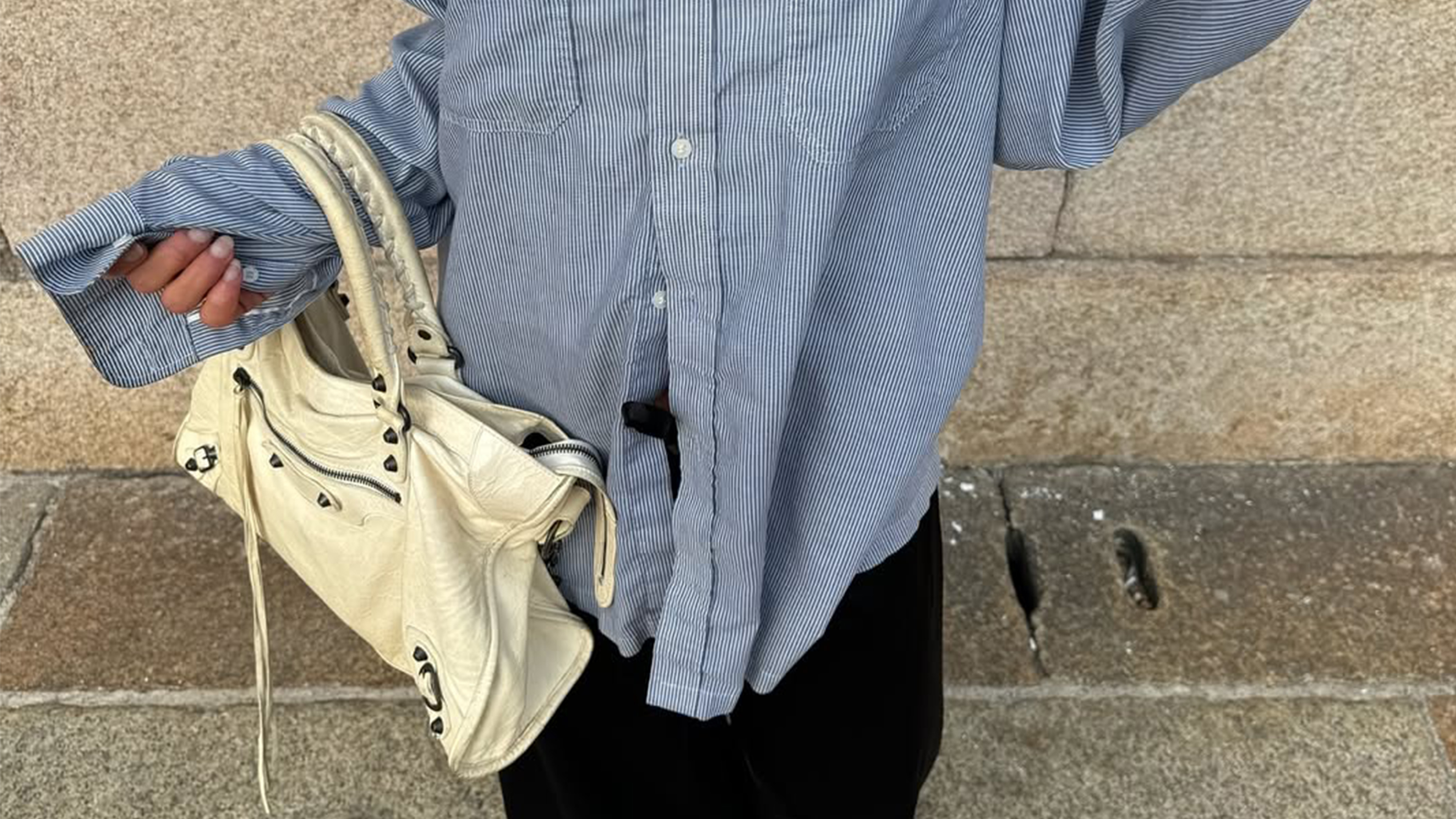 Camelia Farhoodi wearing a Balenciaga bag.
