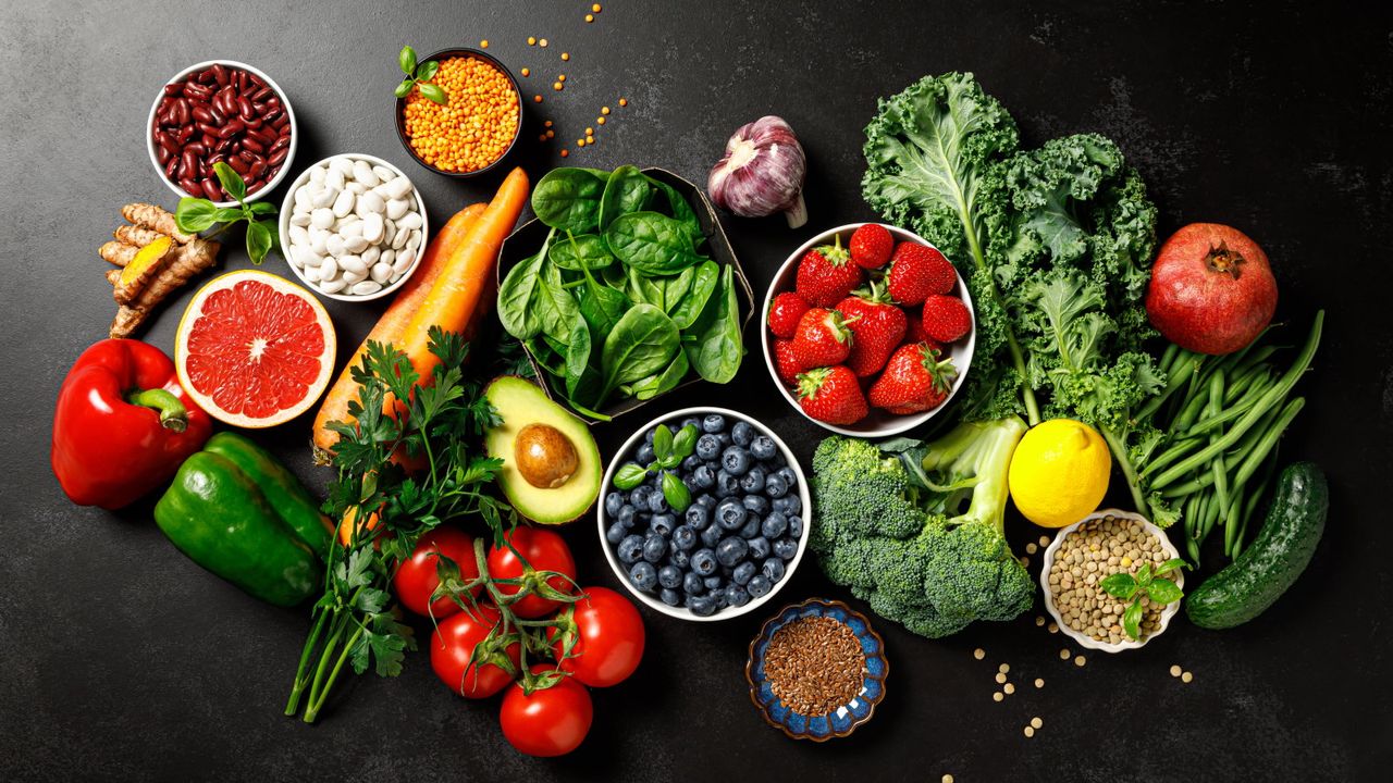 A selection of healthy superfoods on a black background