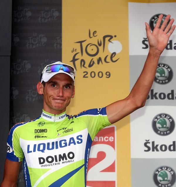 Roman Kreuziger (Liquigas) steps to the podium to receive the white jersey for best young rider.