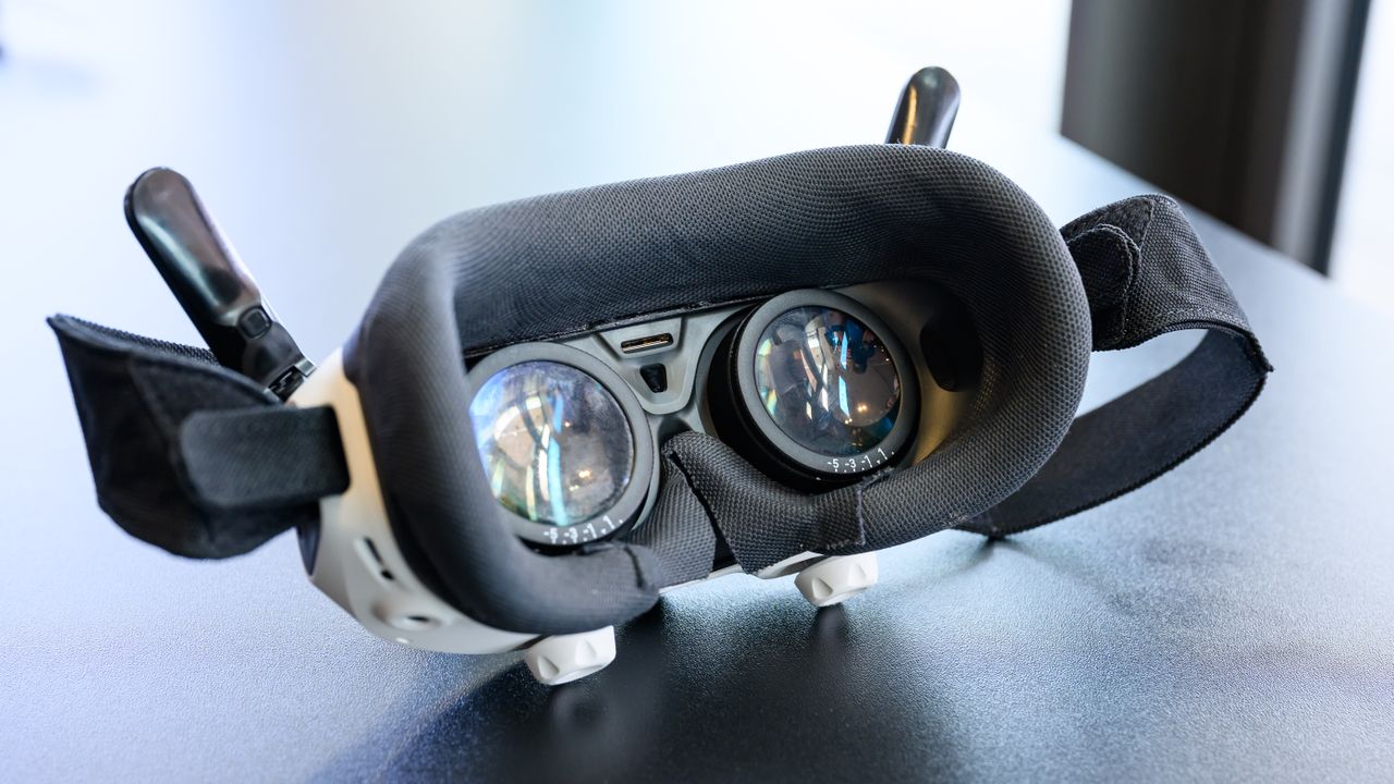 The Antigravity A1 goggles on a surface.