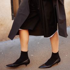 Pointed-toe kitten-heel pumps.