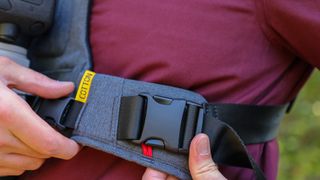 Cotton Carrier G3 worn by a man in a burgandy jacket outdoors in a woods