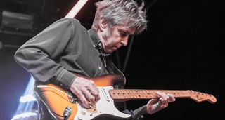 Eric Johnson plays onstage with a Fender Stratocaster.