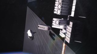 An illustration showing a data center in space with various white modules of servers