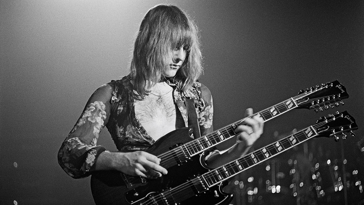Guitarist Alex Lifeson from the Canadian band Rush performs live on stage playing a Gibson EDS-1275 twin neck/double-neck guitar at the McMorran Arena in Port Huron, USA during their All the World&#039;s a Stage tour on 22nd May 1977