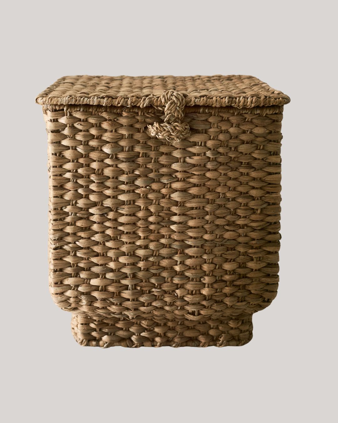 handmade basket storage against pale beige background.