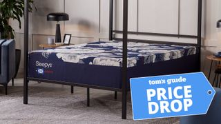 The Sleepy's By Sealy HD Firm Mattress on a bed frame in a bedroom, a Tom's Guide price drop deals graphic in the bottom right corner
