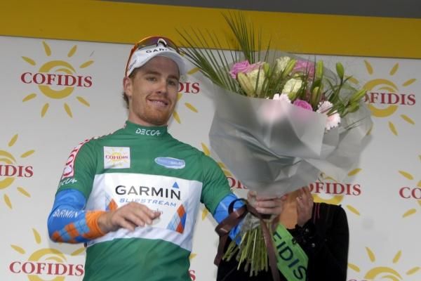Tyler Farrar (Garmin-Slipstream) contemplates yet another bouquet.