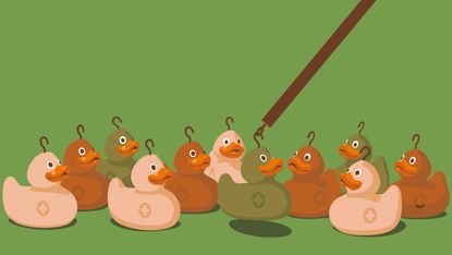 ducks being picked by a hook like a carnival game
