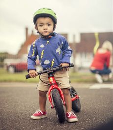 Child on a balance bike.