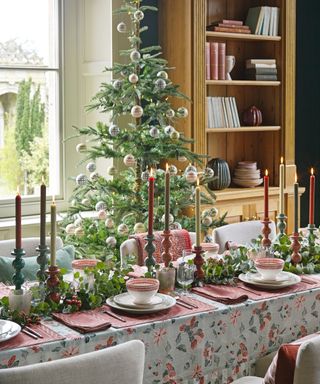 Christmas dining table with tree in background