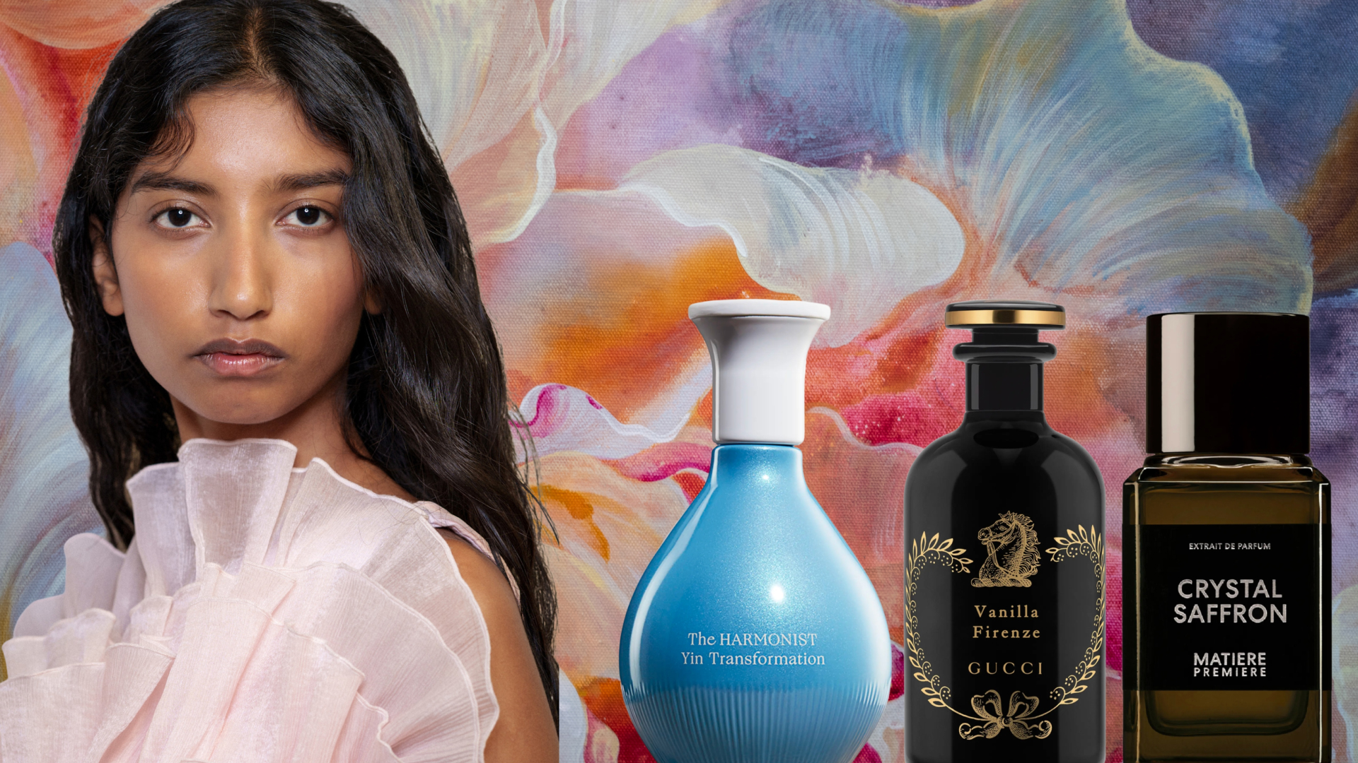 A model with wavy hair wearing a floral top. She is next to three bottles of perfume. All of the images are in front of a floral background. 