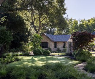 Lush planting around pristine lawn