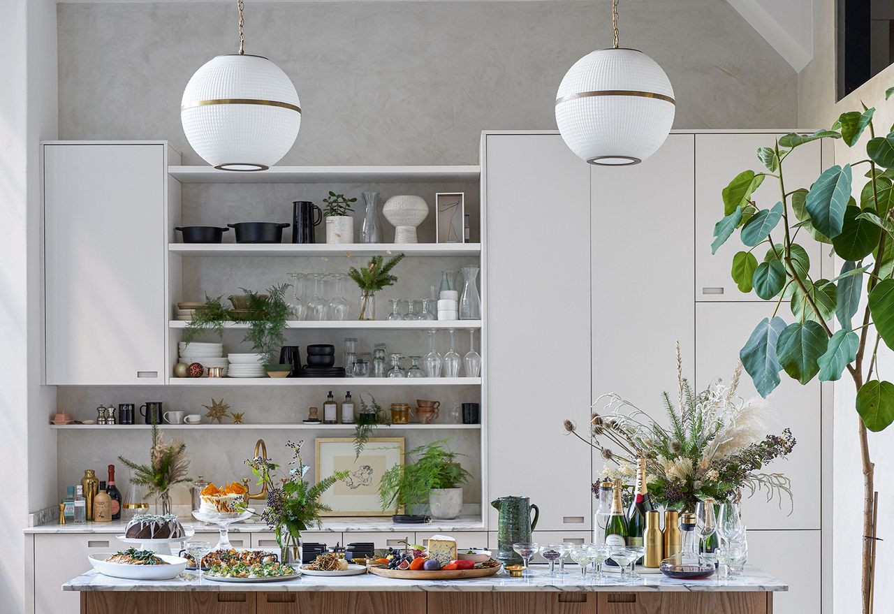 modern kitchen with open shelves and two round pendant lights above the island