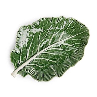 Arket green leaf plate designed to look like a lettuce leaf.