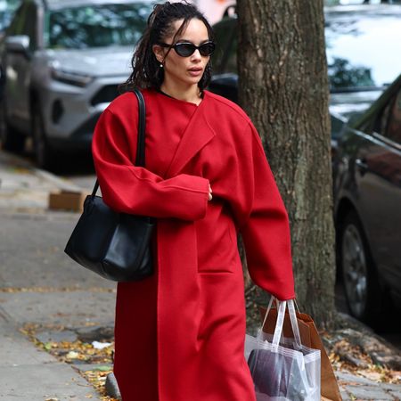 Zo&euml; Kravitz wearing a red coat.