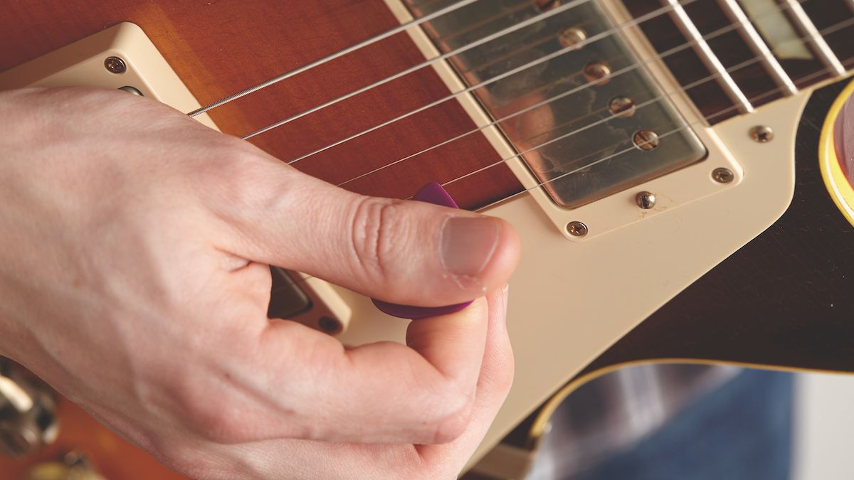 Should you play guitar with a pick or fingers? Guitar World