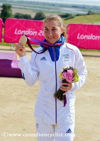 Olympic Champion, Julie Bresset (France) shows off her gold medal.