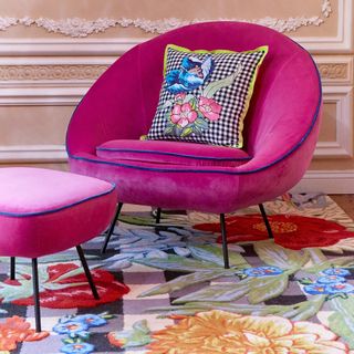 pink chair with floral cushion and floral floor