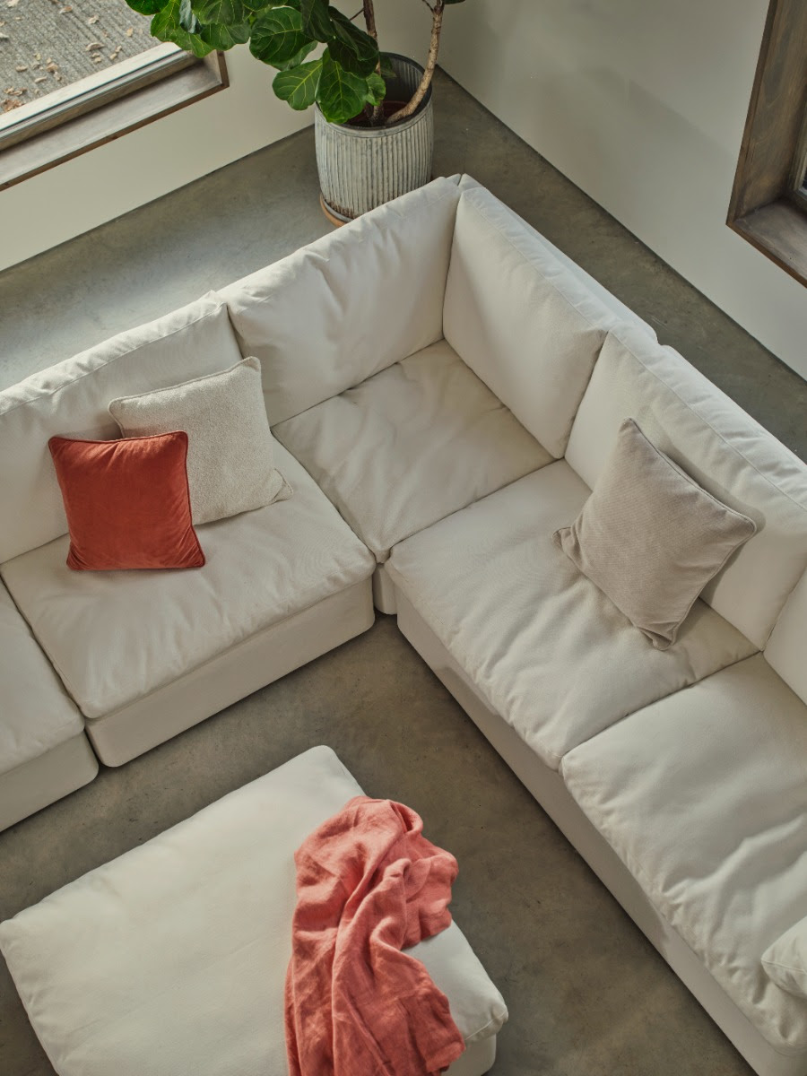 Overhead image of a white sectional sofa