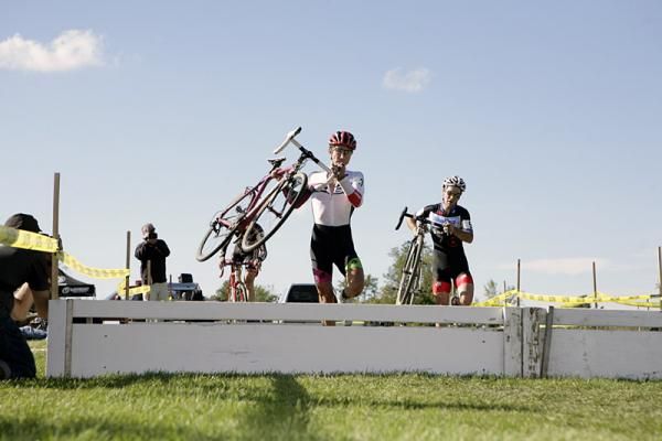 Luca Damiani (Colavita Sutter Home p/b CookingLight) leads Justin Lindine (BikeReg.com / Cannondale) over the barriers.
