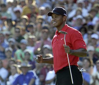 Tiger Woods celebrates winning the 2006 PGA Championship