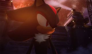 Shadow The Hedgehog stands in front of the wall of a base