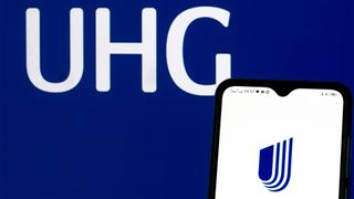 UnitedHealth Group logo displayed on a smartphone screen with branding pictured on blue background.