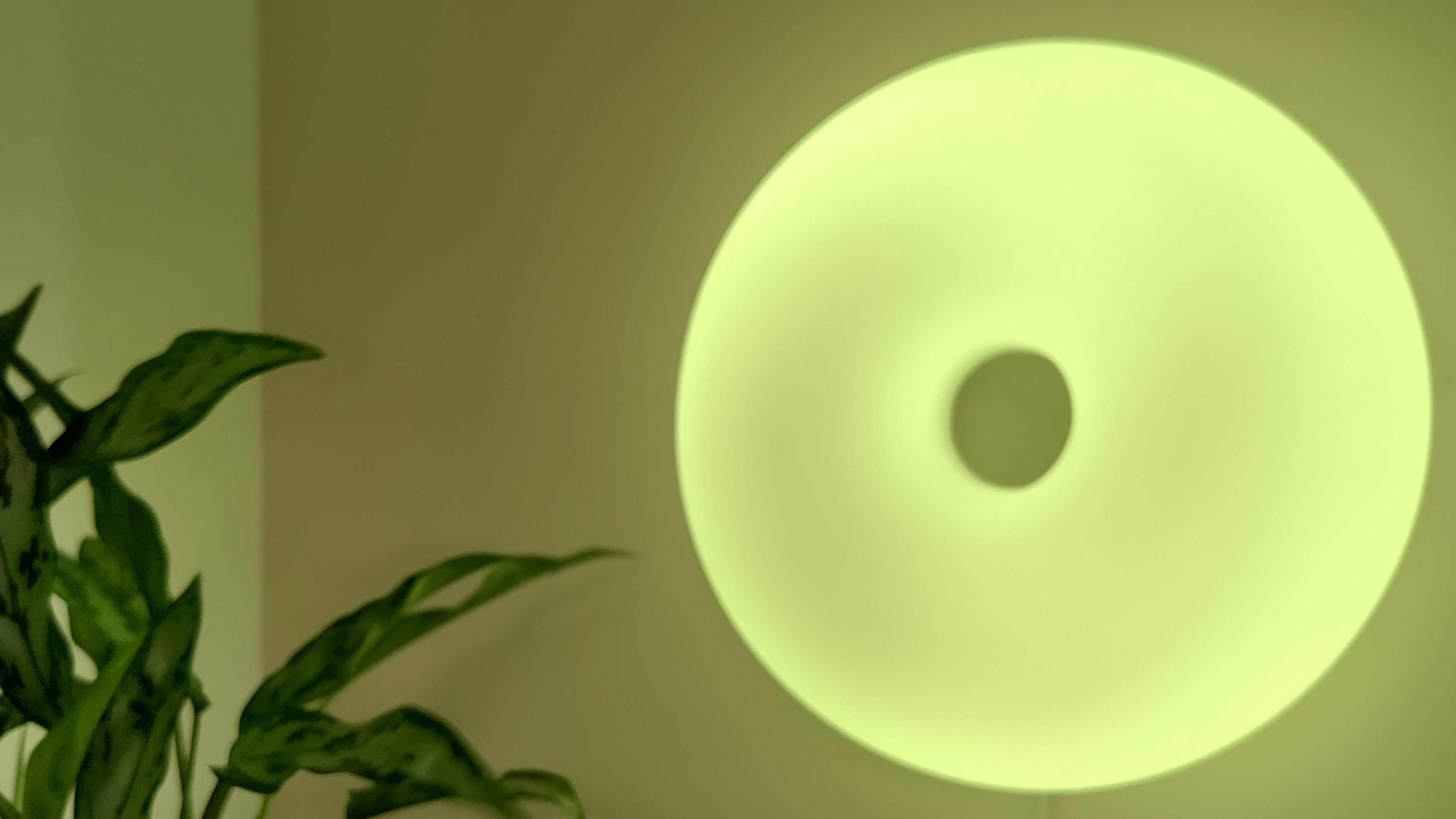 IKEA Varmblixt lamp illuminated yellow on wall