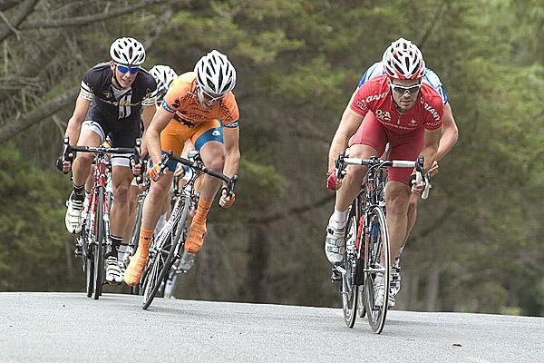 Rhys Pollock (right) of Drapac Porsche goes on the attack with Daniel Furmston (left) of Genesys Wealth Advisers tries to grab his wheel.