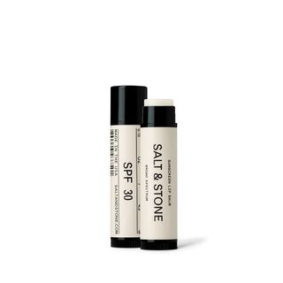 Two Salt & Stone SPF lip balms, one with its top off